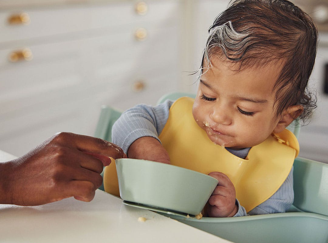 Baby eating from a bowl